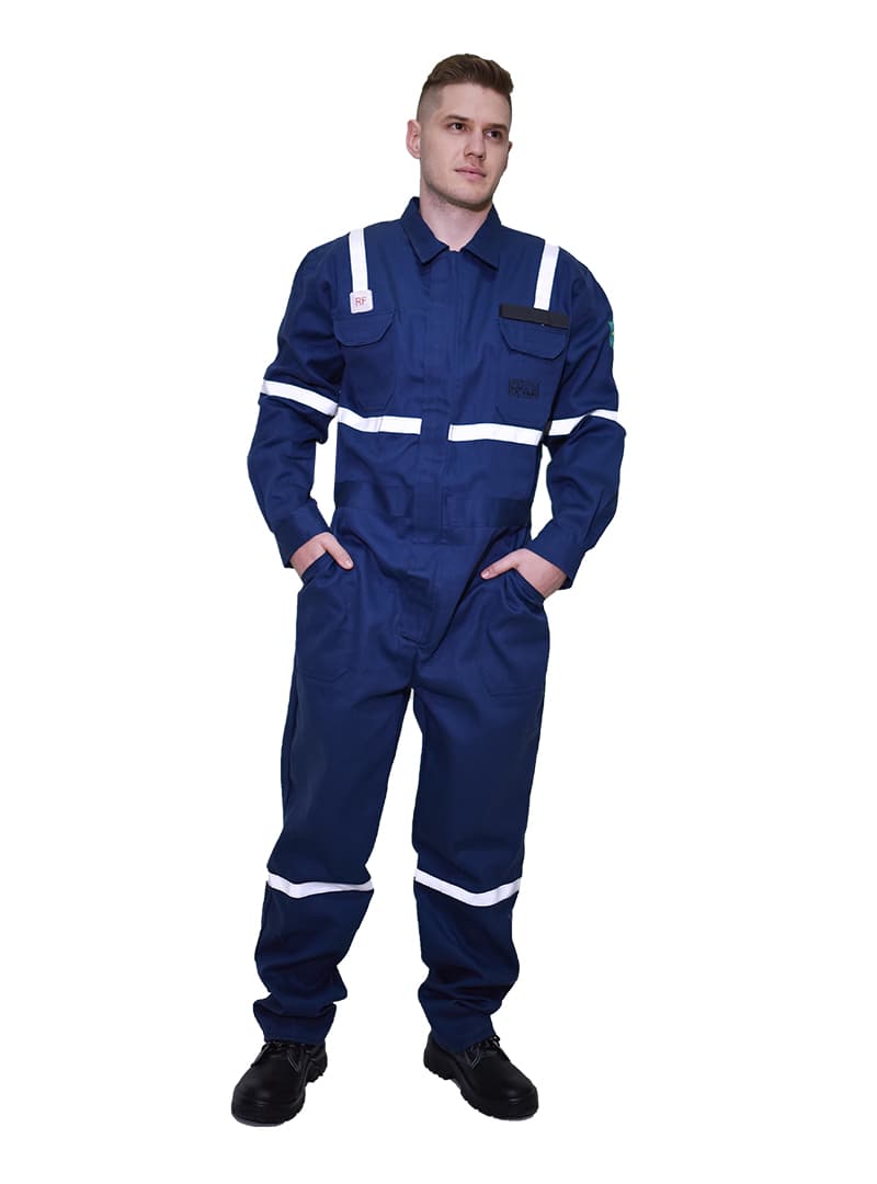 Worker wearing a navy acid-resistant coverall with white reflective bands.