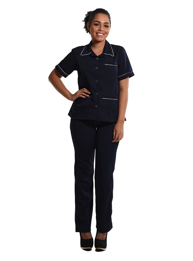 Facilities professional wearing a navy cleaning service uniform set with white piping.