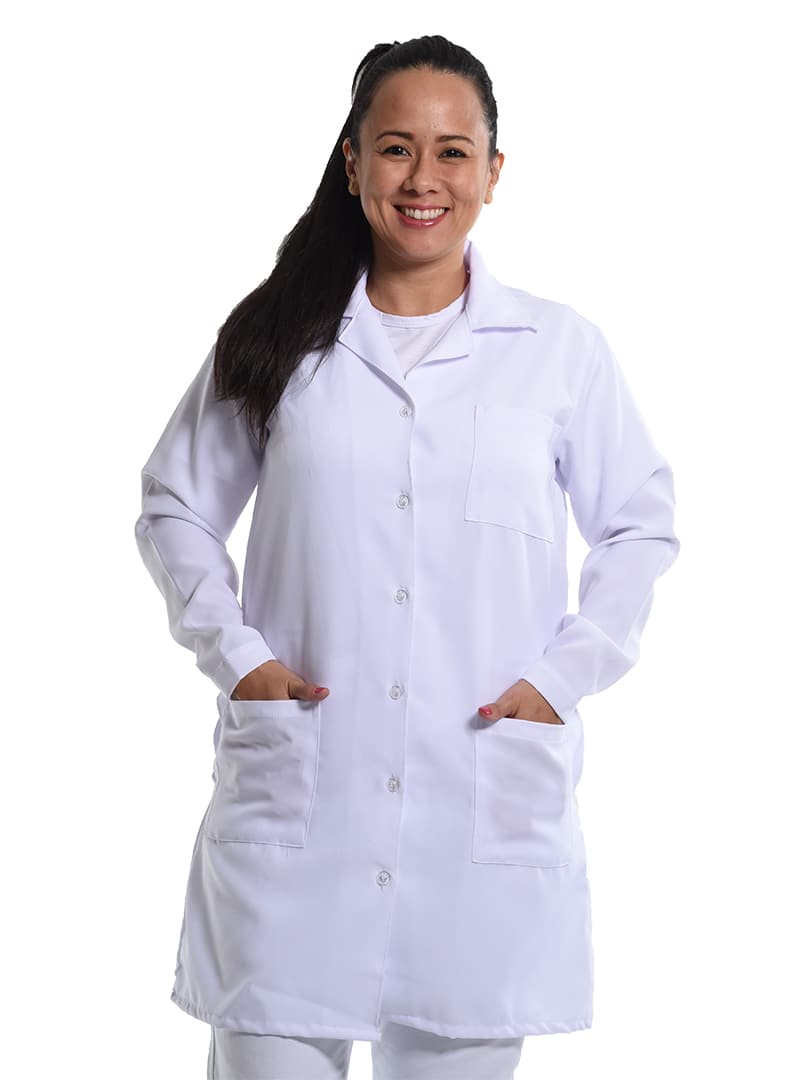 Healthcare professional wearing a white lab coat over clinical scrubs.