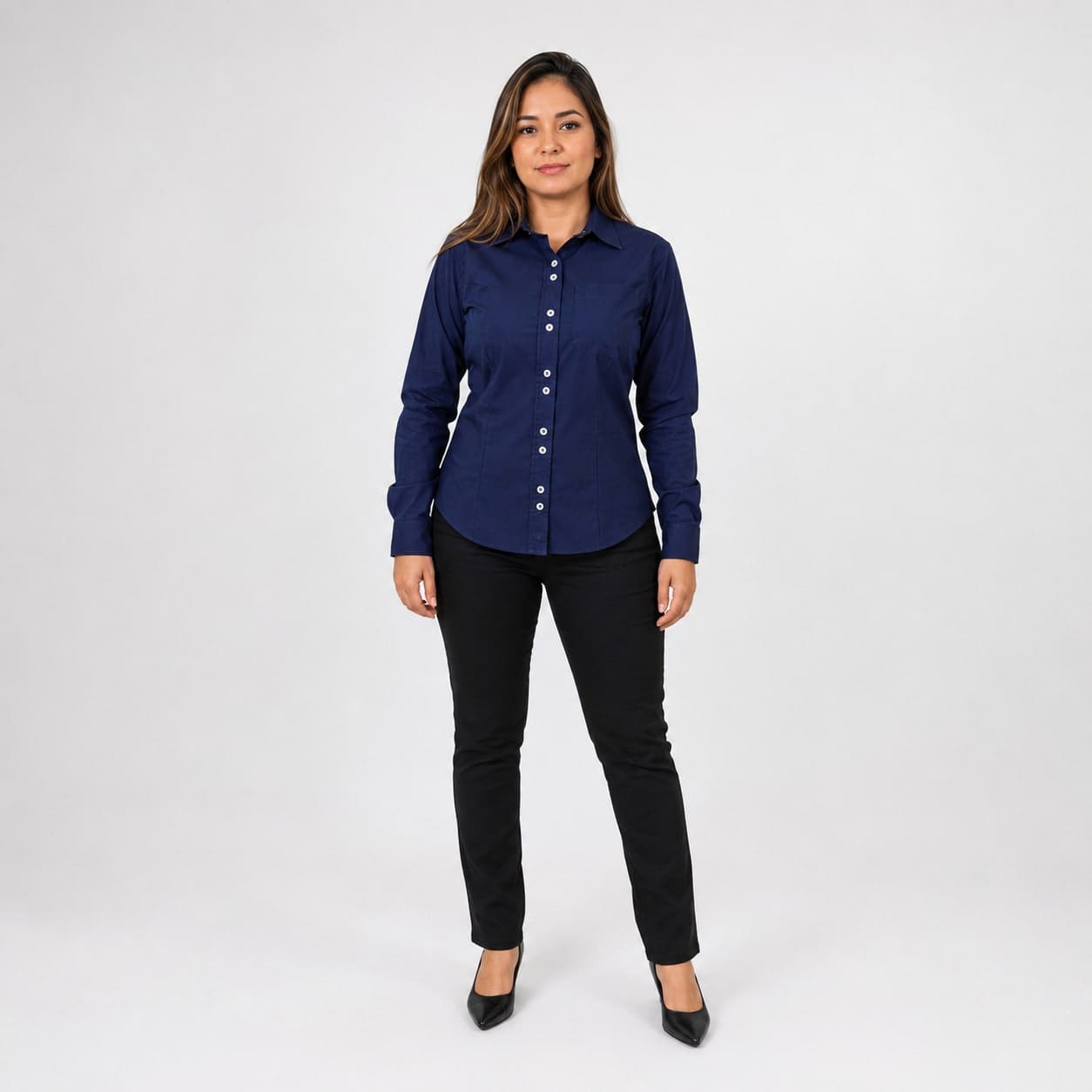 Professional wearing a navy corporate dress shirt with black tailored trousers.